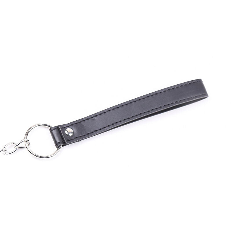 Peniksen talutin hihnalla. Kuva taluttimesta.